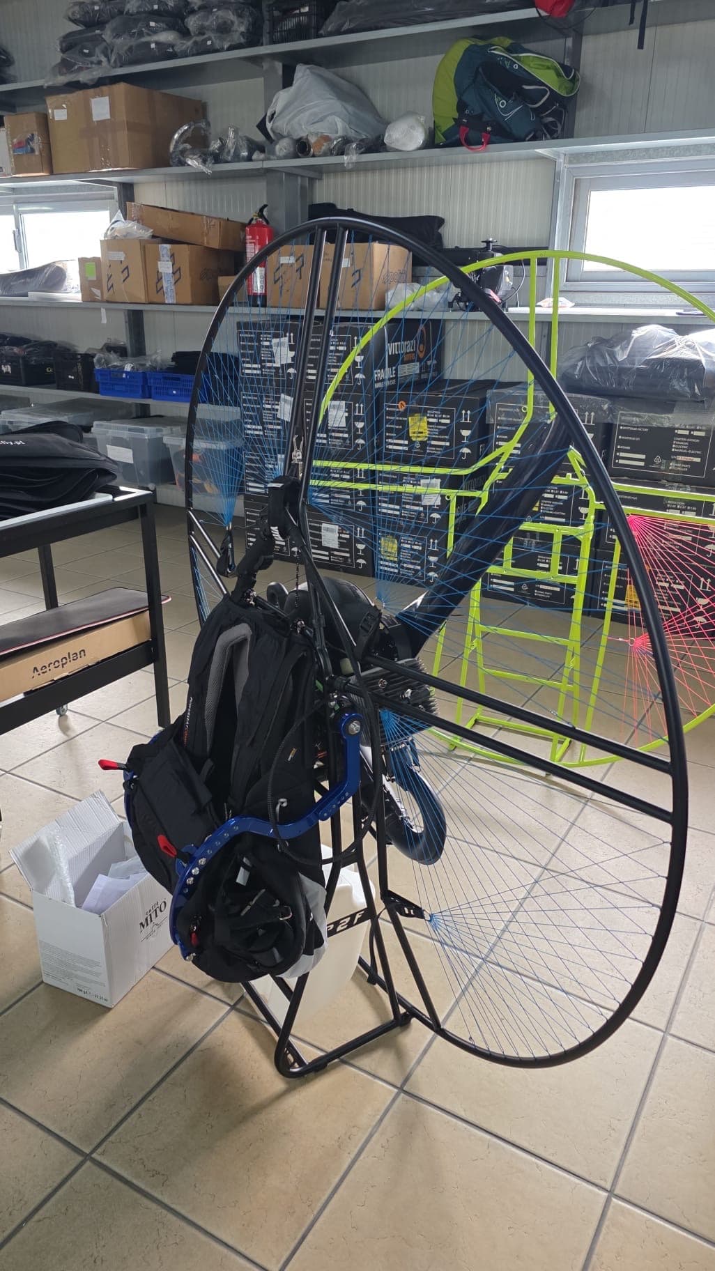 A Power2Fly Explorer paramotor — full rig with cage and Vittorazi engine.